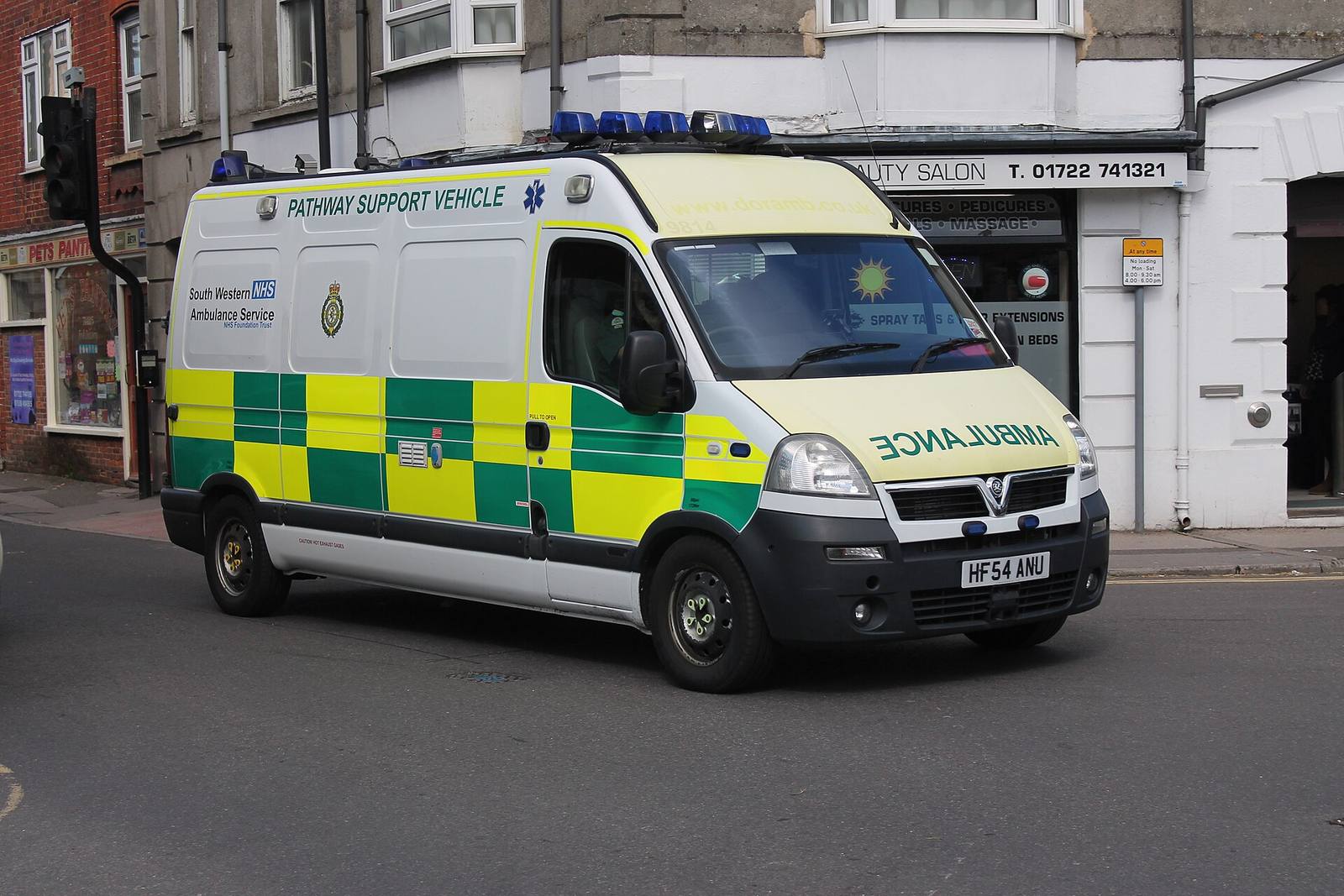 An NHS ambulance on a street