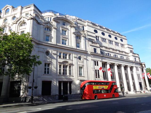 Canada House on Cockspur Street in Westminster, with a red London bus passing