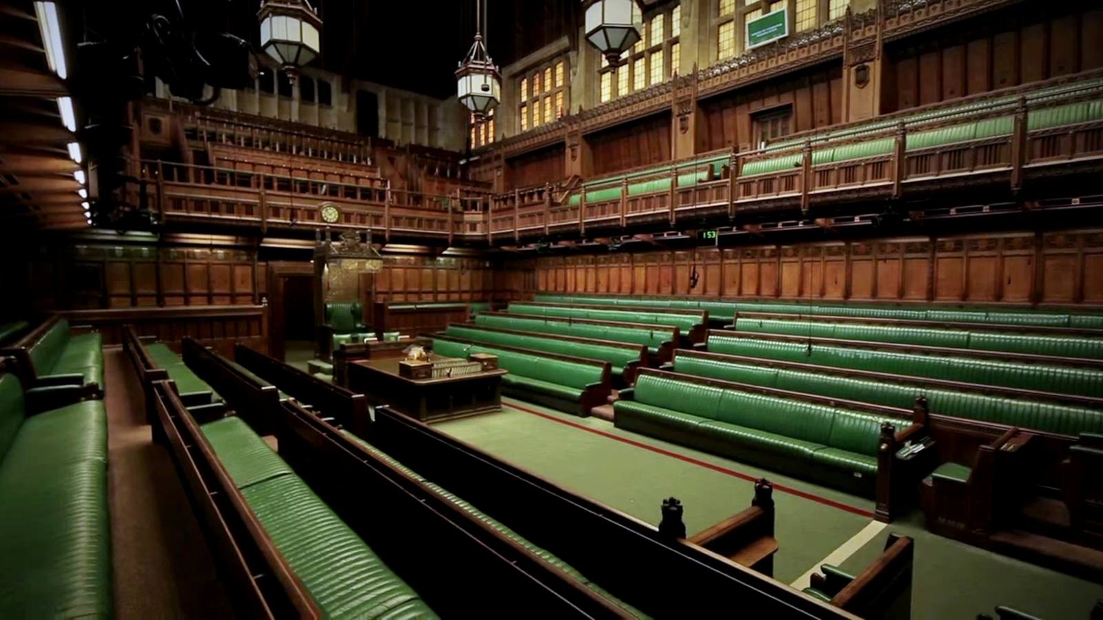 The interior of the House of Commons chamber with its green benches