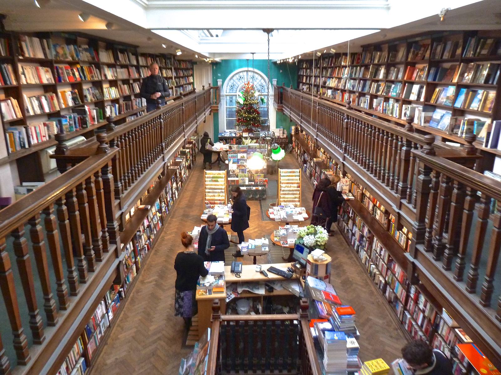 The galleried interior of Daunt Books in Marylebone, London, with readers browsing the shelves