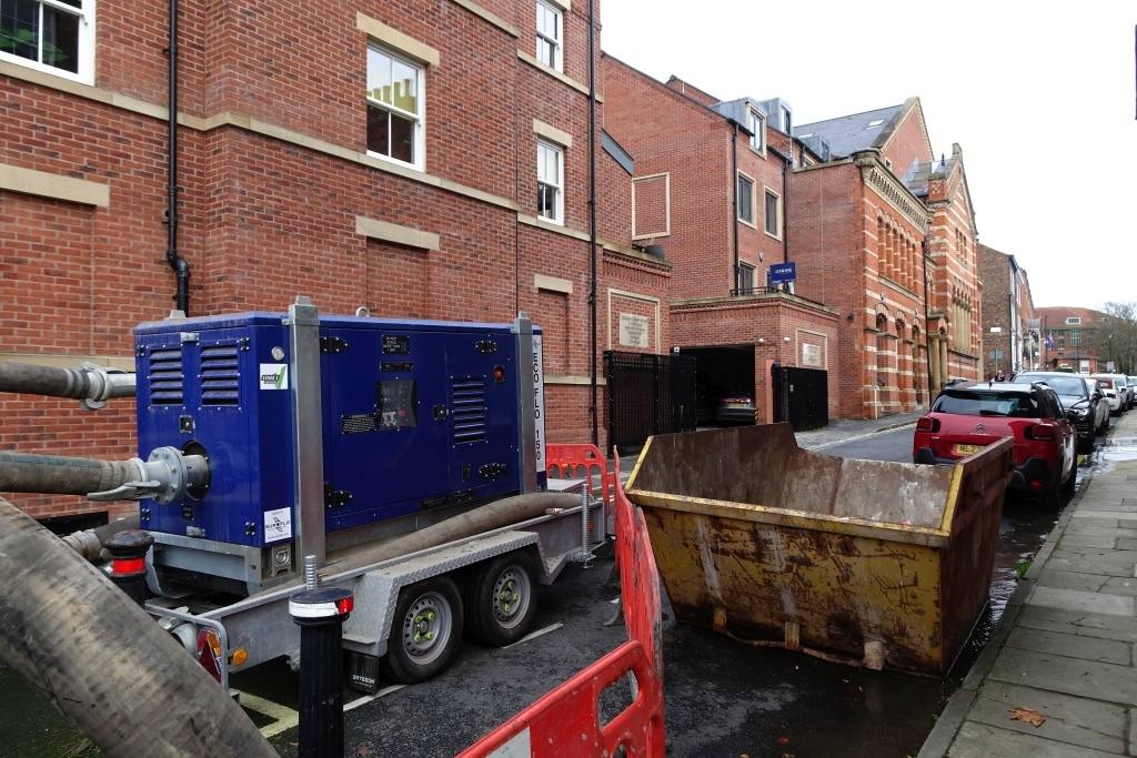 A mobile flood pump trailer on a street