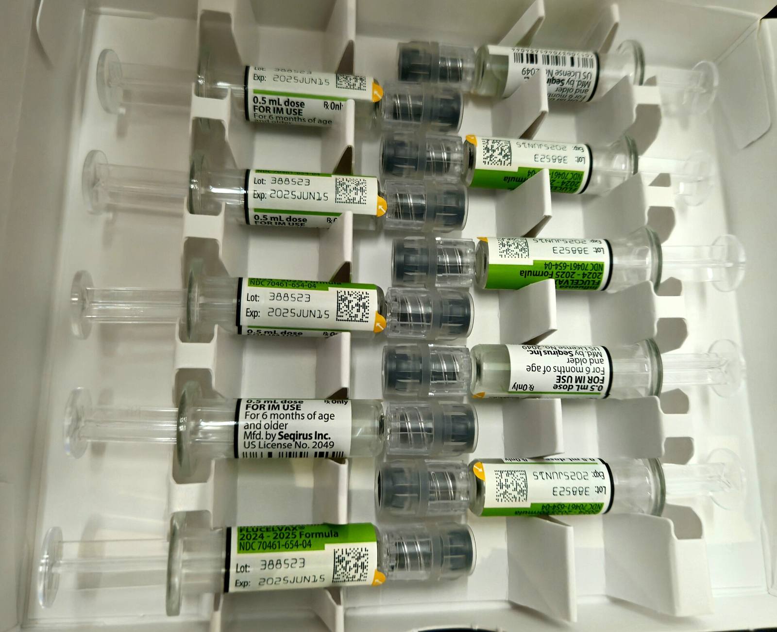 Flu vaccine doses in syringes