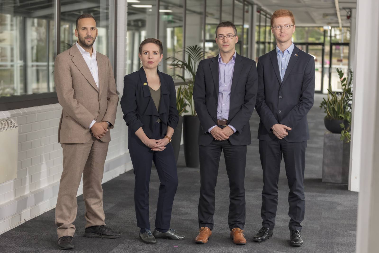Four Green Party figures, Zack Polanski, Carla Denyer, Adrian Ramsay and Ross Greer, standing together