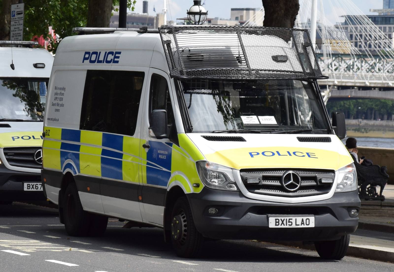 A Metropolitan Police van with blue and yellow livery