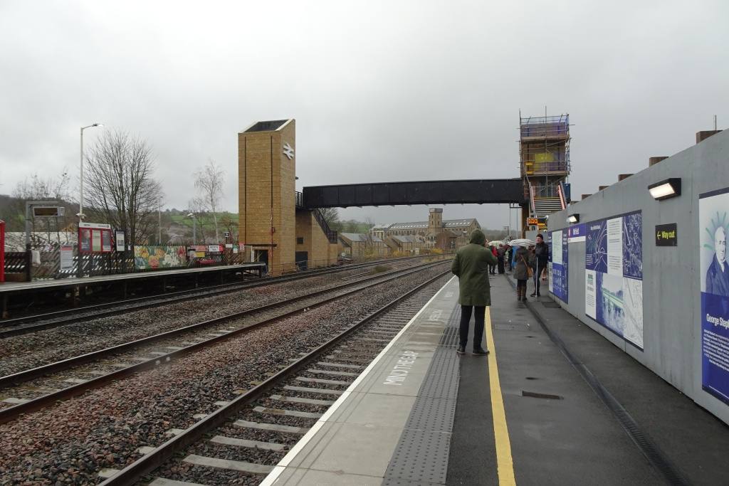 Passengers on a rainy platform at Mirfield station