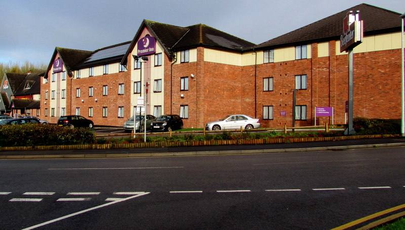 The brick Premier Inn hotel at Telford Central, seen across the road with cars parked outside