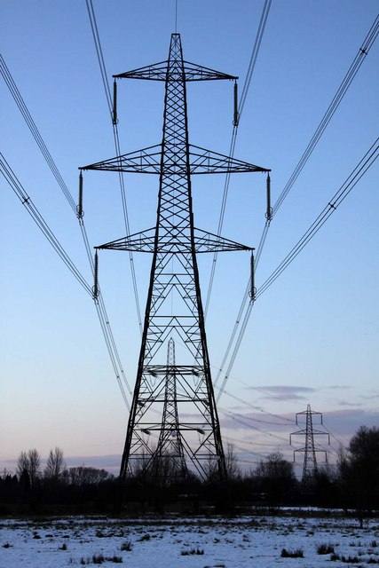 Electricity pylons against a winter sky
