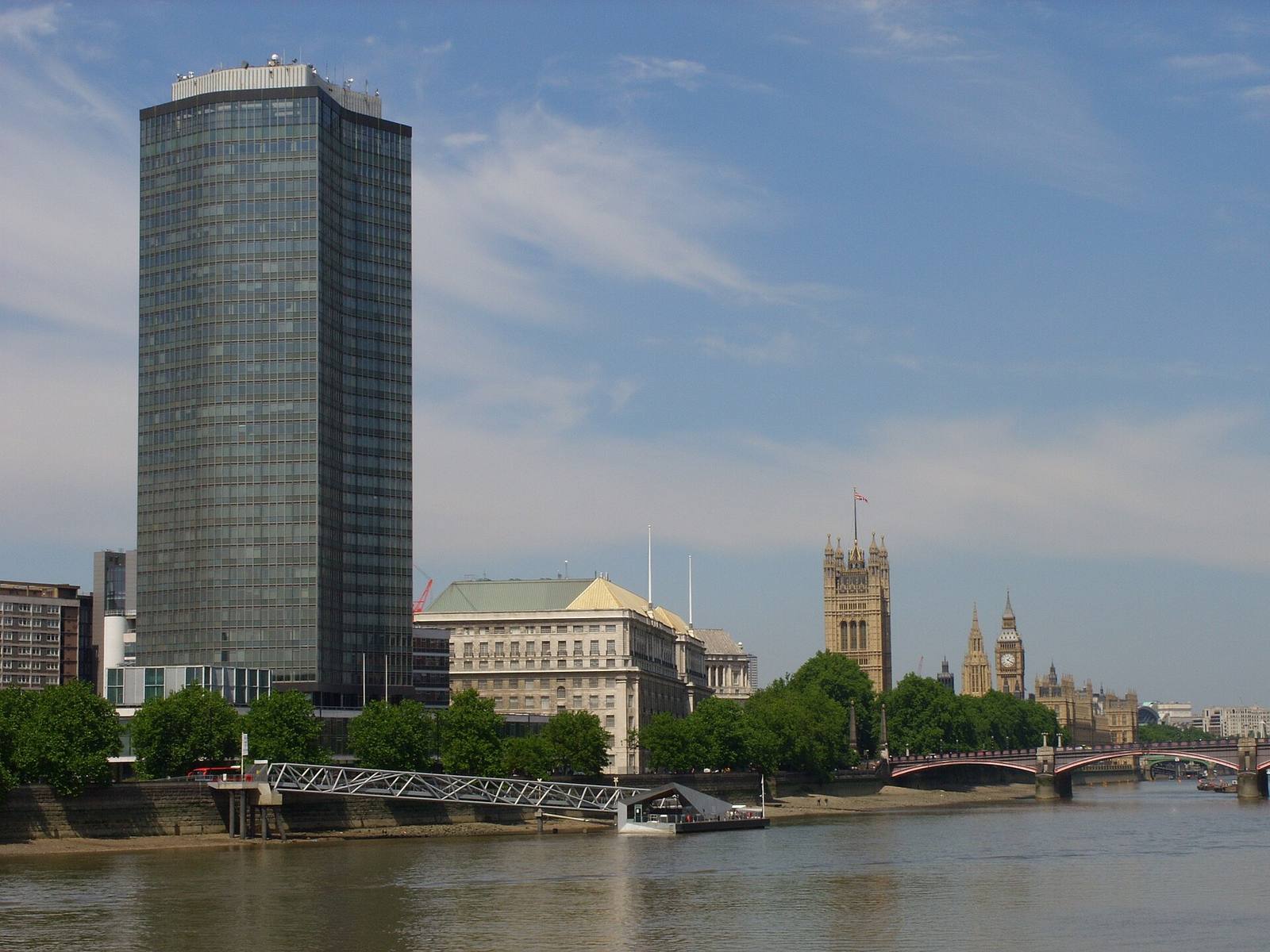 Thames House and Millbank Tower on the north bank of the Thames, with the Palace of Westminster in the distance