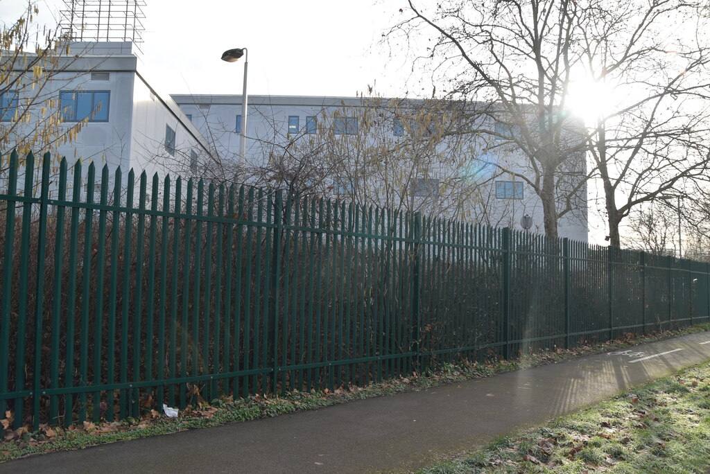 Woolwich Crown Court building seen behind a perimeter fence