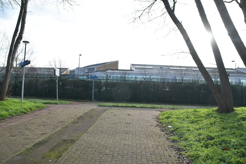Paved path leading towards the Woolwich Crown Court building