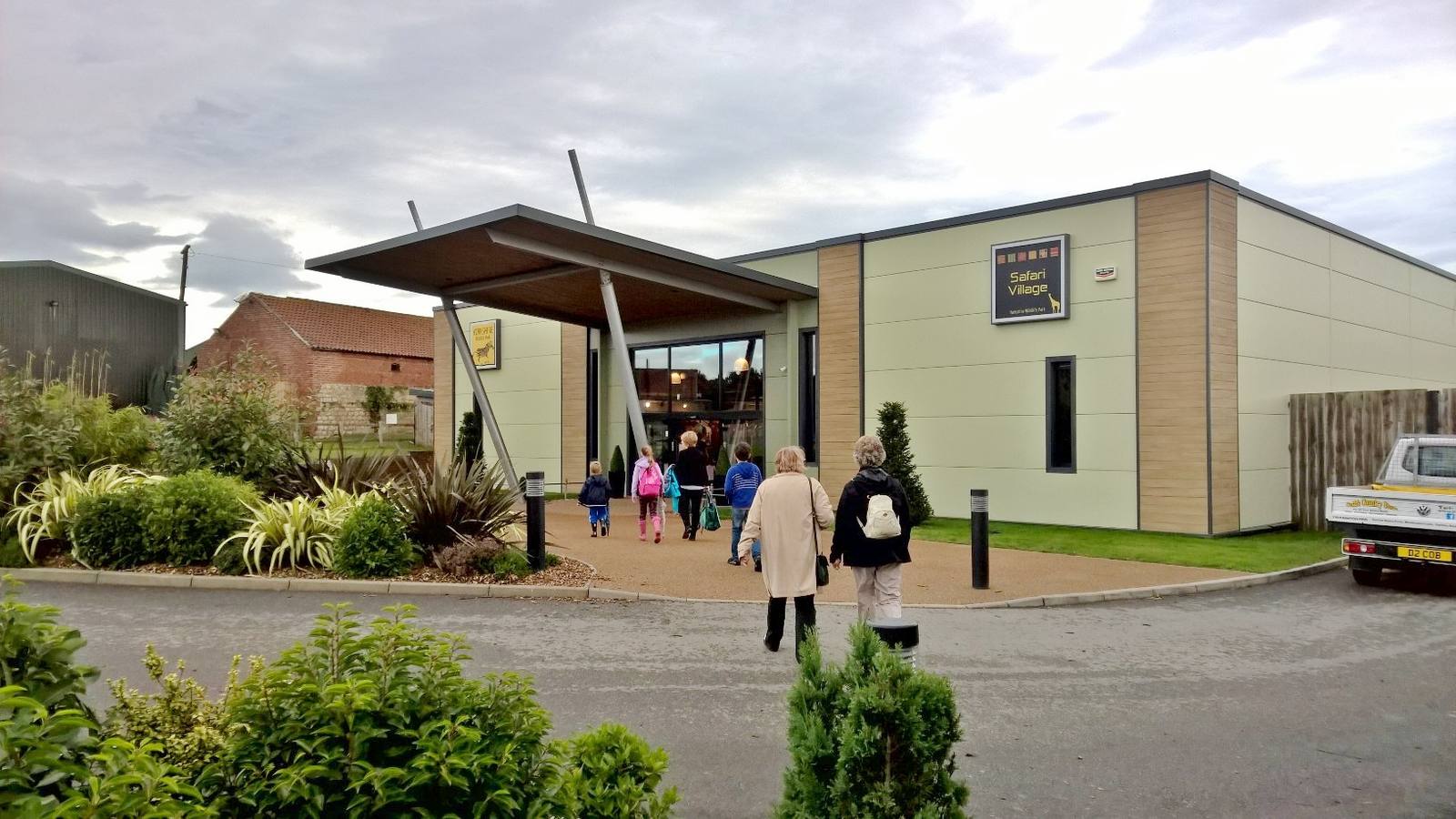 Visitors walking towards the Safari Village entrance building at Yorkshire Wildlife Park